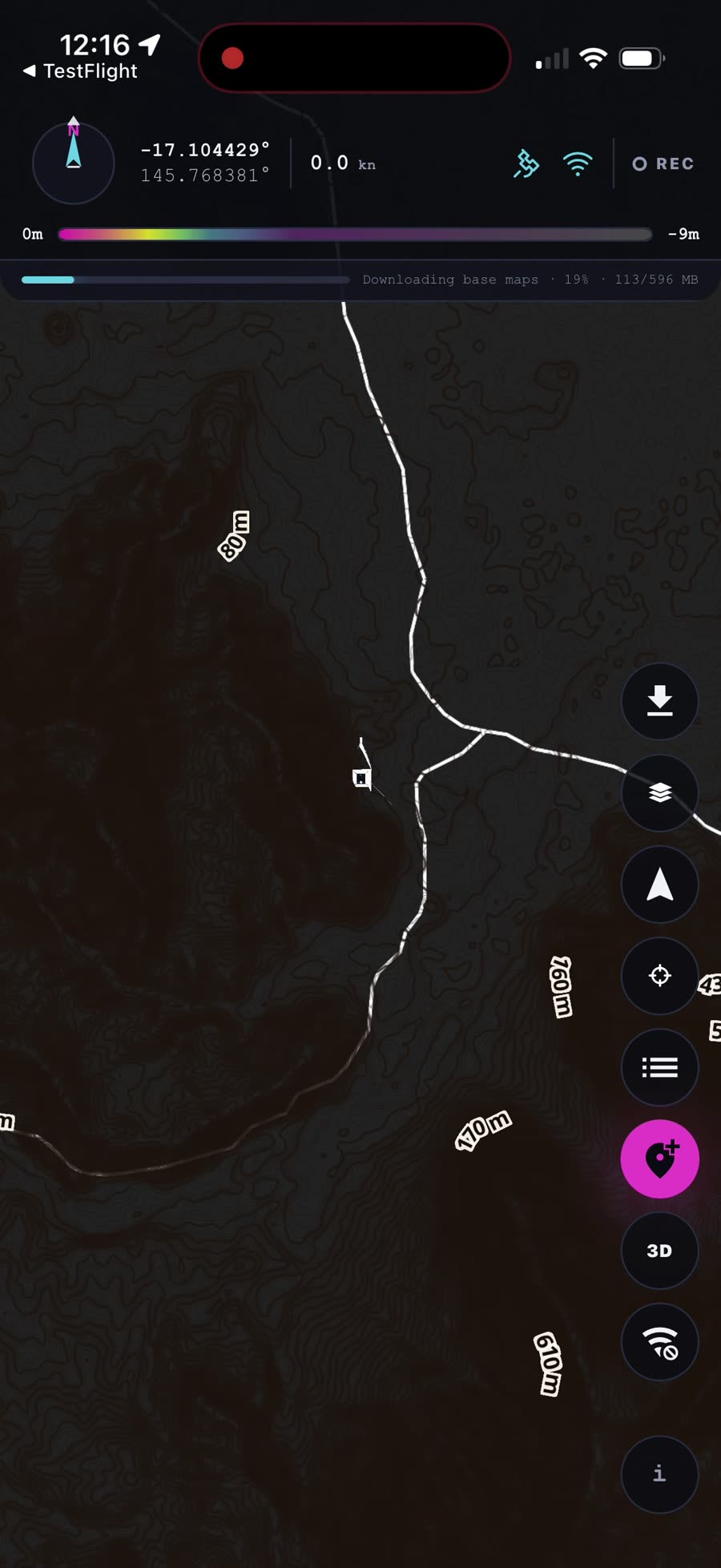 The map on first launch with the Downloading base maps progress bar across the top